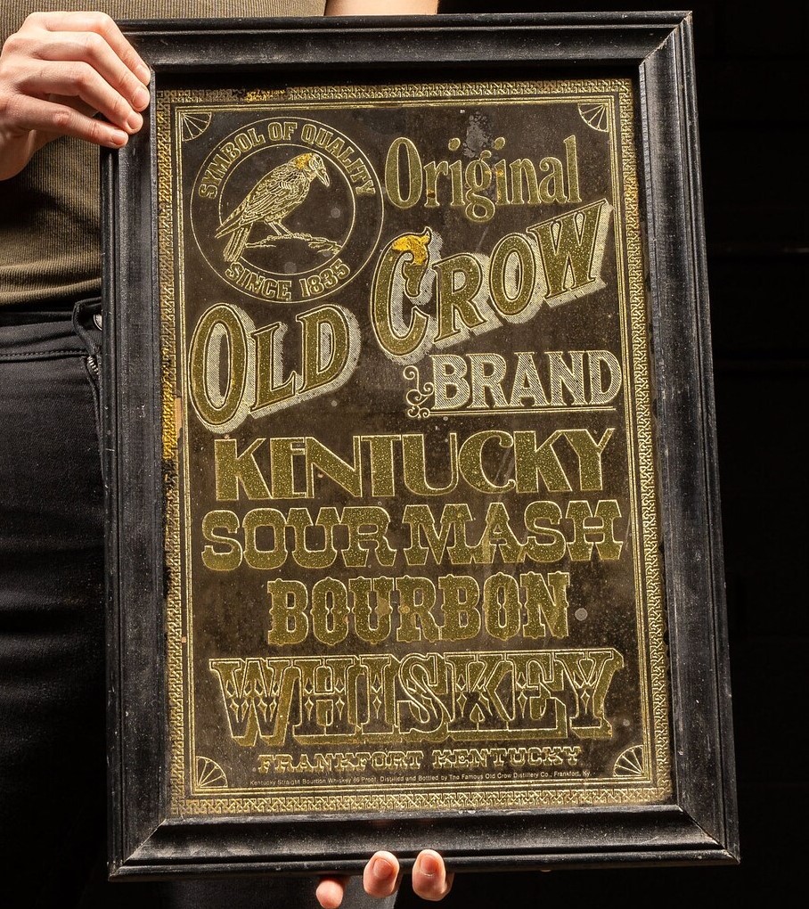 Vintage framed advertisement for Old Crow Kentucky Sour Mash Bourbon Whiskey from Frankfort, Kentucky